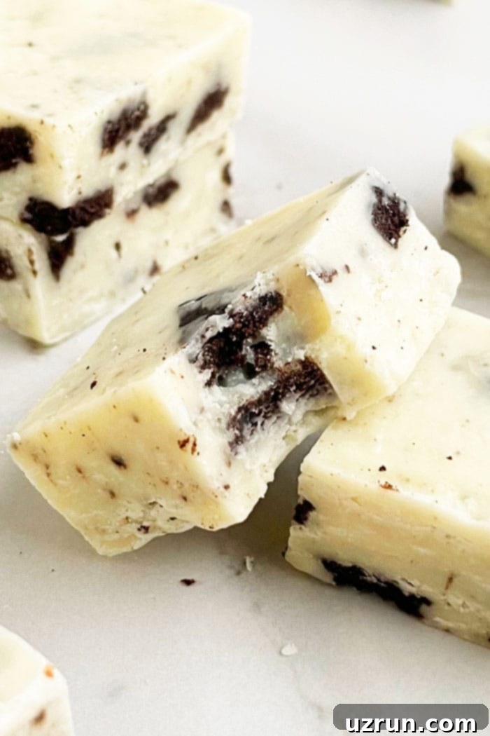 Oreo Fudge 3 Close-up of Partially Eaten Easy Microwave Oreo Fudge (Cookies and Cream Fudge) on White Base