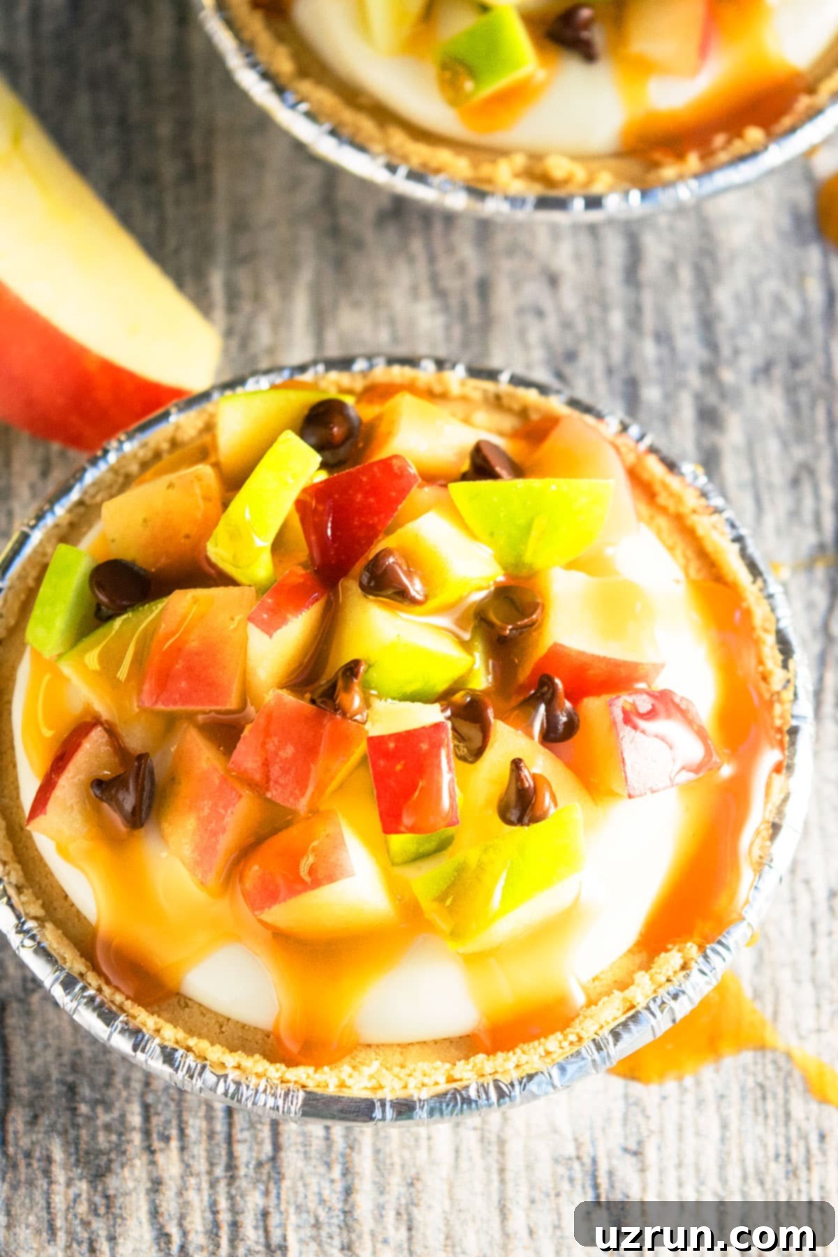 Easy No-Bake Caramel Apple Pie 4 No Bake Apple Pie With Cream Cheese Filling on Rustic Gray Background.