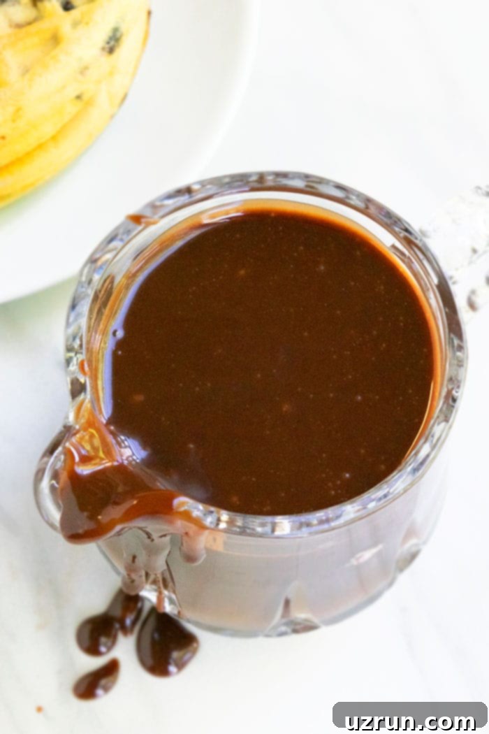 Easy Hot Fudge Sauce With Condensed Milk in Small Glass Pitcher 
