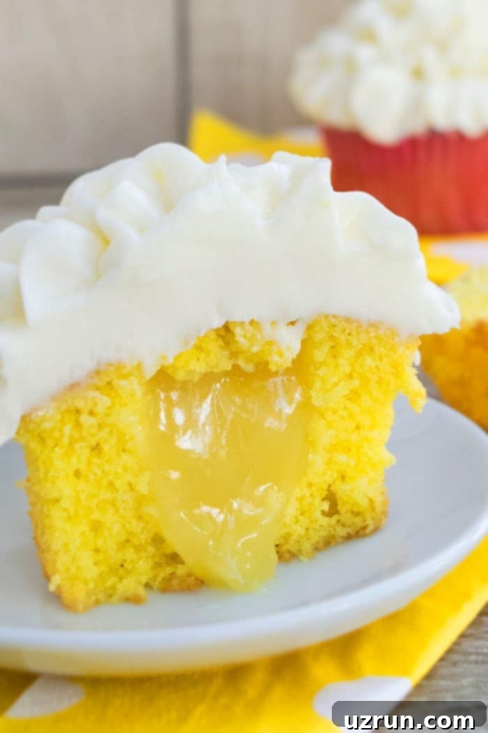 Crafting Cupcakes with Irresistible Fillings 6 Lemon Cupcakes Filled With Lemon Curd on White Plate