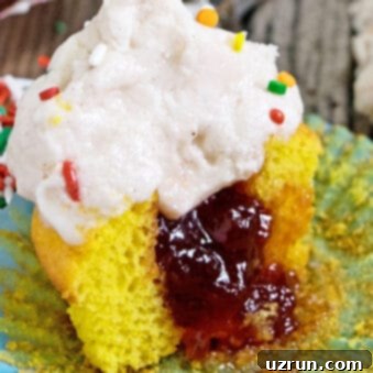 Crafting Cupcakes with Irresistible Fillings 9 Easy Filled Cupcakes With Jam (Stuffed Cupcakes) on Rustic Wood Background
