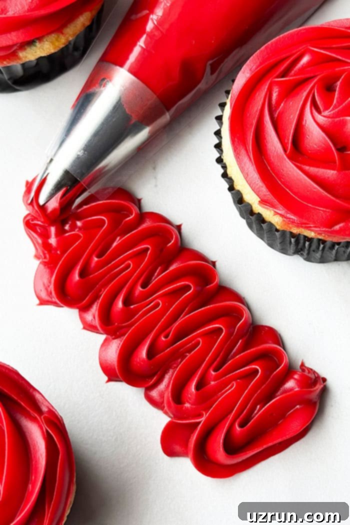 How to Make Red Velvet Frosting 4 Red Velvet Frosting Piped on White Background