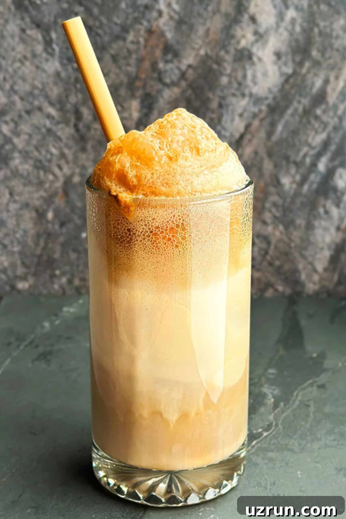 Easy Root Beer Float in Big Glass Mug on Rustic Gray Background with vanilla ice cream and root beer soda.