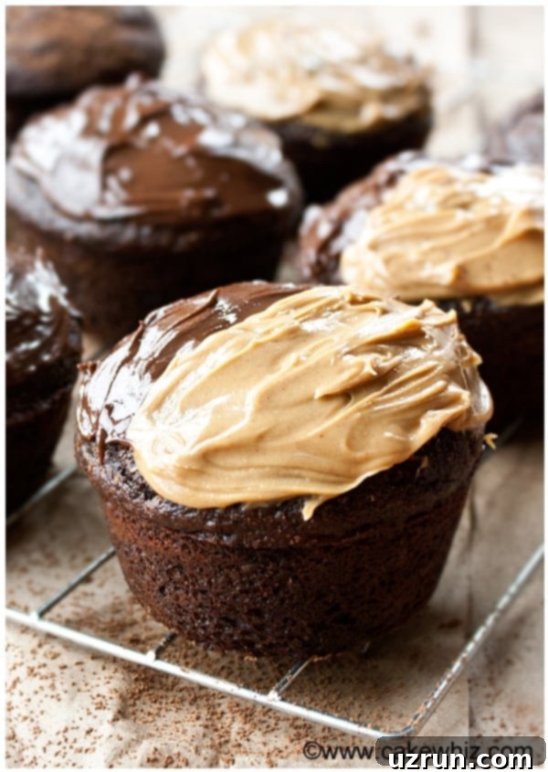 Easy Sugar Free Chocolate Cupcakes on Cooling Rack Topped Off With Chocolate Hazelnut Spread and Peanut Butter. 