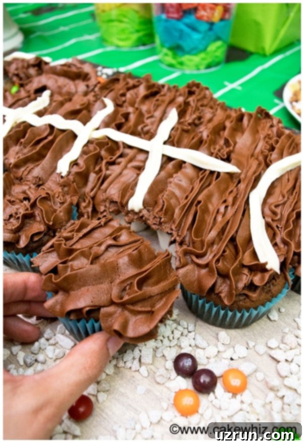 Touchdown Treats: Football Party Cake and Cupcakes 3 Pulling Apart One Cupcake From Football Cake