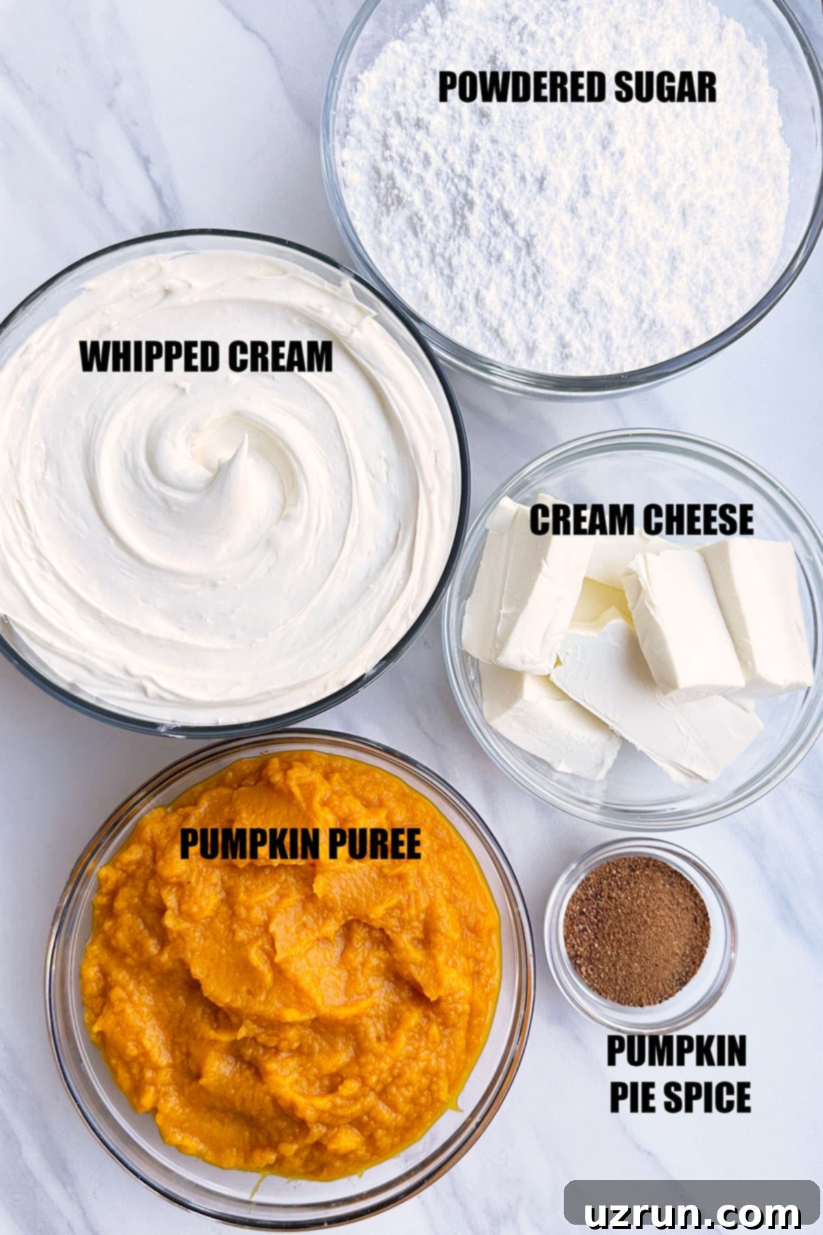 No-Bake Pumpkin Cheesecake Dip 3 Ingredients in Bowls For Sweet Dip on White Marble Background.