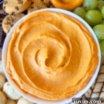 No-Bake Pumpkin Cheesecake Dip 5 Easy Pumpkin Dip in White Bowl on Tray With Cookies.