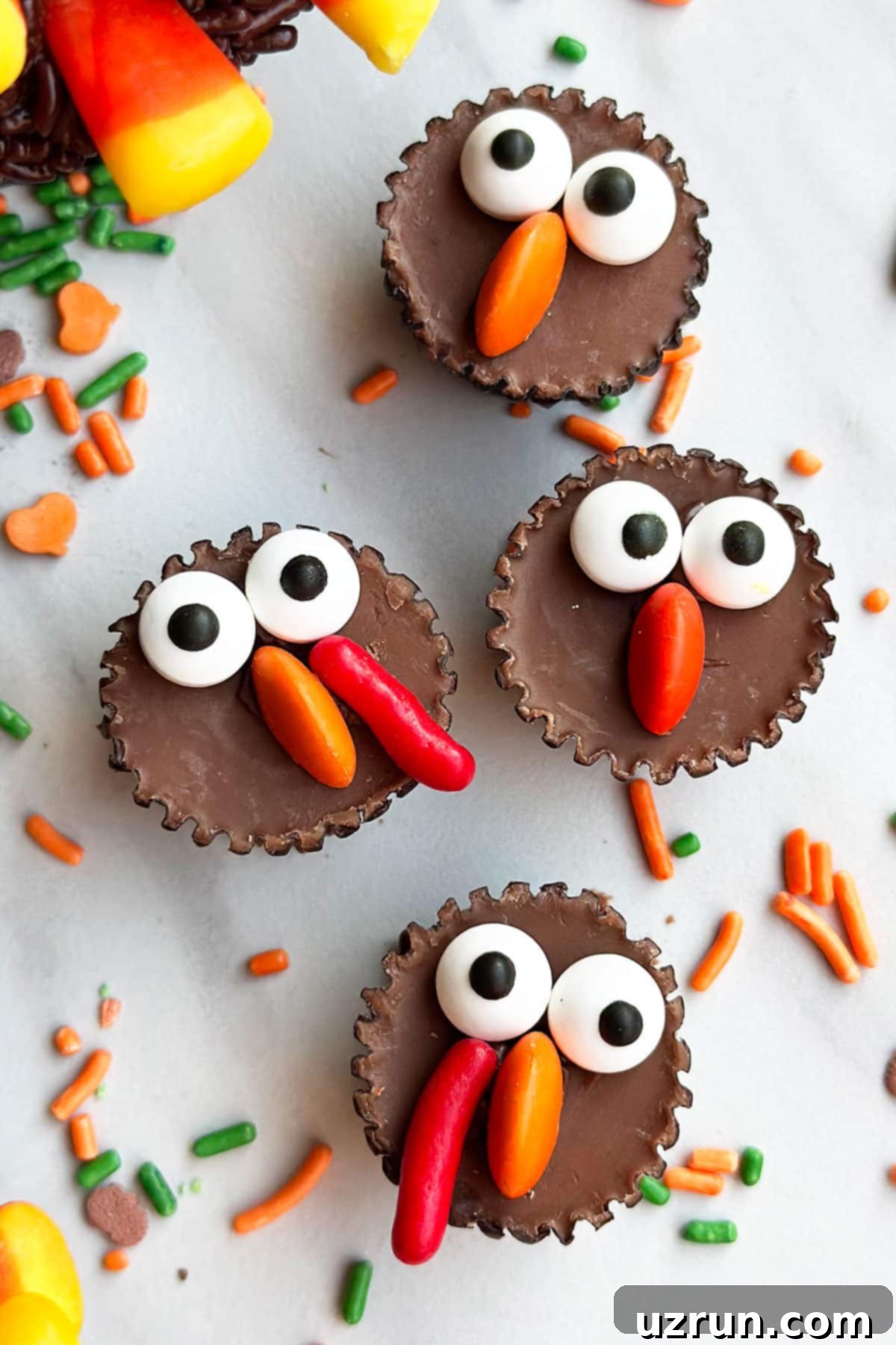 Simple Thanksgiving Turkey Cupcakes 6 Turkey Chocolate Peanut Butter Cups on White Marble Background.