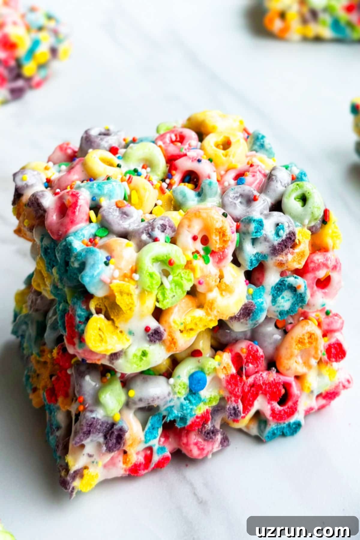Stack of Easy Cereal Bars With Rainbow Froot Loops. 