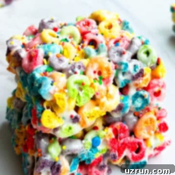 Three-Ingredient Rainbow Cereal Bars 13 Stack of Easy Cereal Bars With Rainbow Froot Loops.