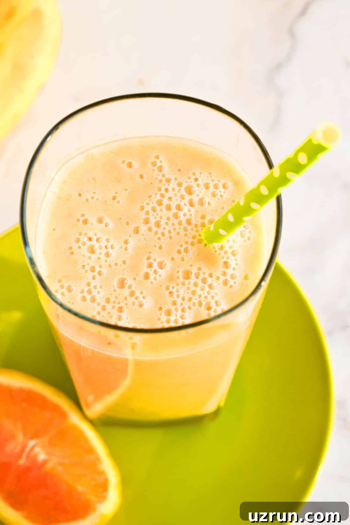 Sunshine Mango Trio Smoothie 3 Closeup Shot of Smoothie in Glass Cup.