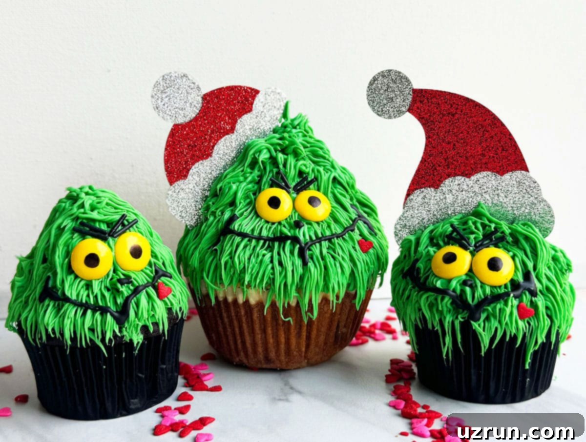 Easy Grinch Cupcakes with Buttercream Icing 6 Variety of Holiday Cupcakes on White Marble Background.