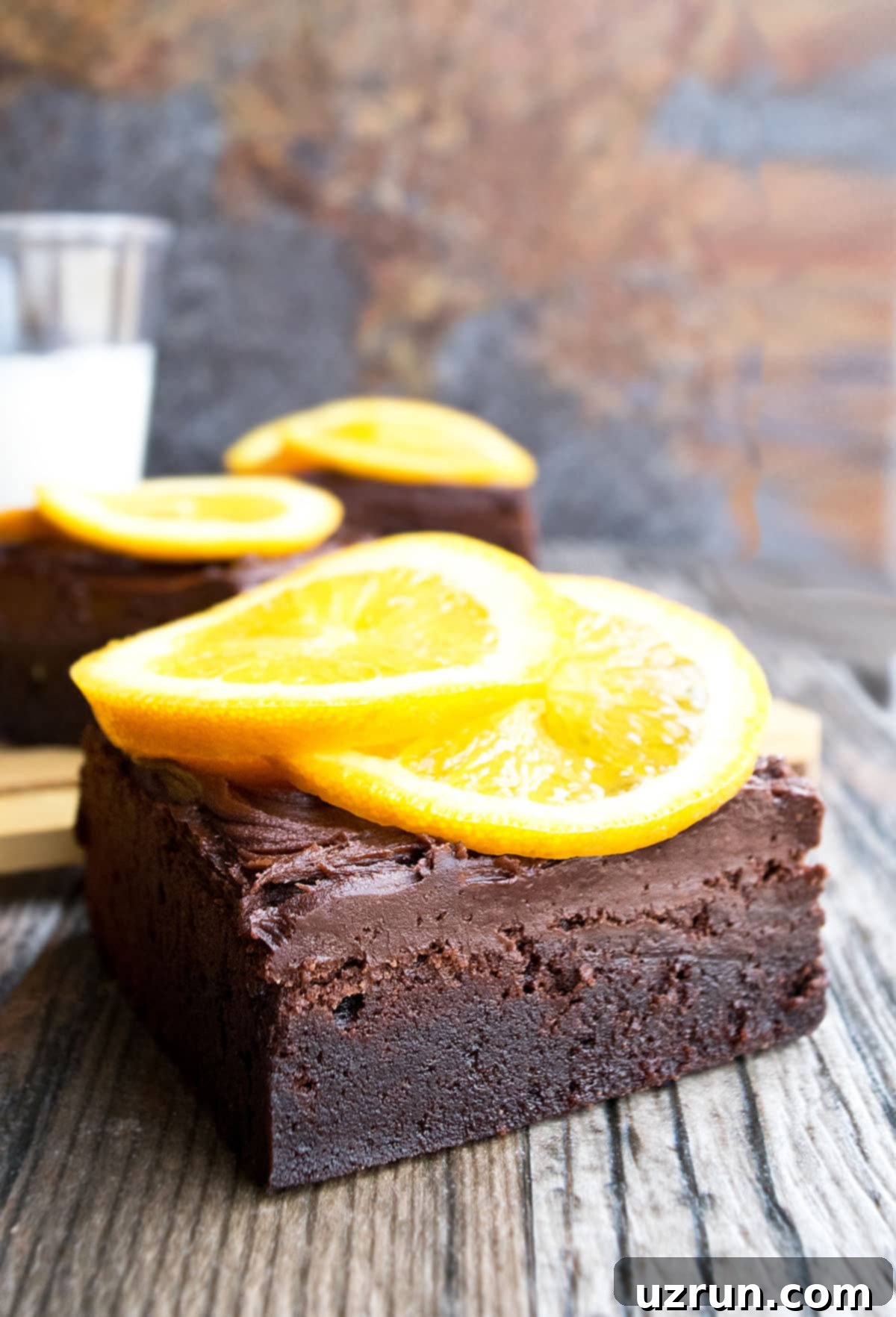 Slice of Chocolate Orange Brownies With Chocolate Buttercream Frosting and Fresh Orange Slices. 