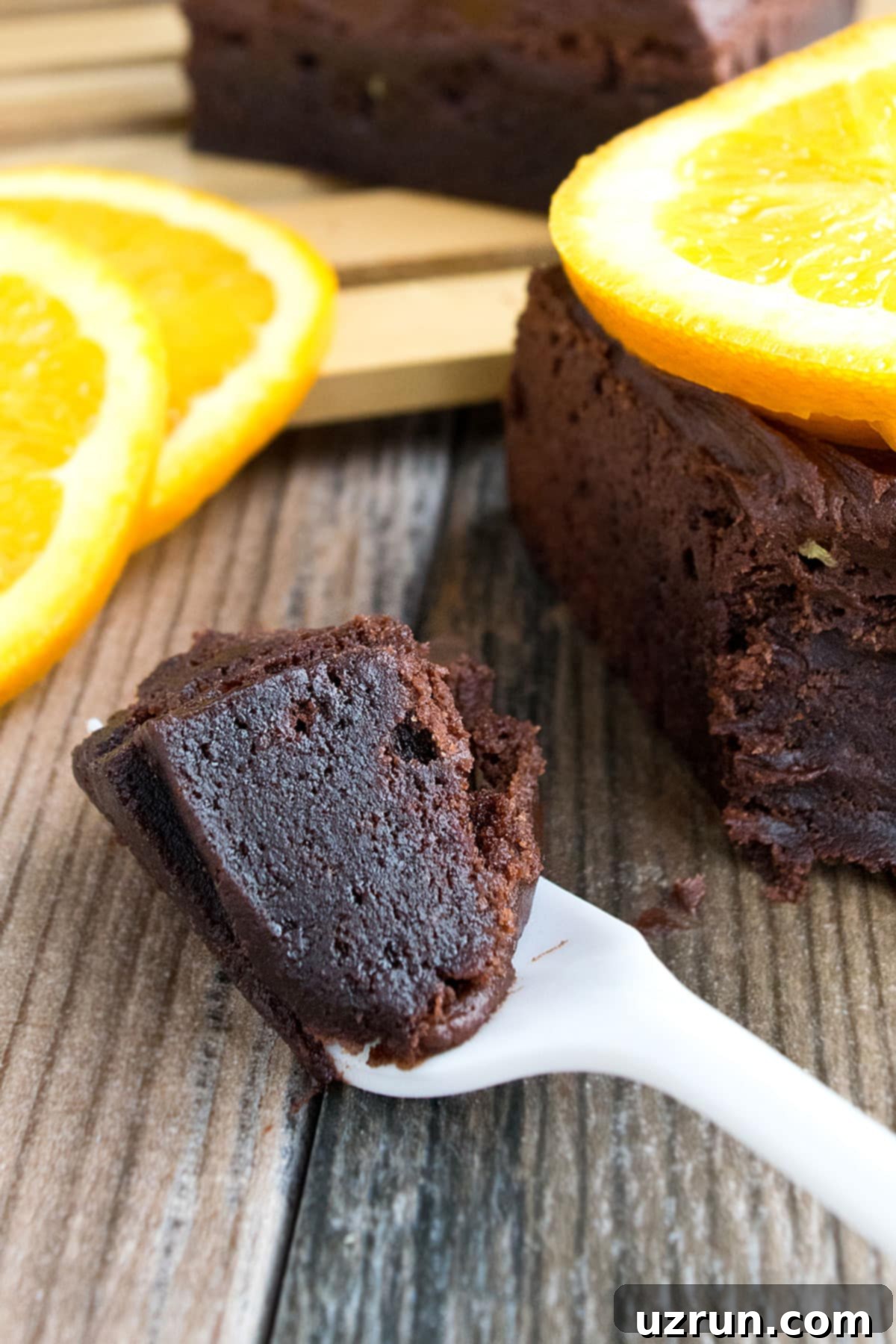 Fudgy Chocolate Orange Brownies 12 Spoonful of Brownie on Rustic Background.
