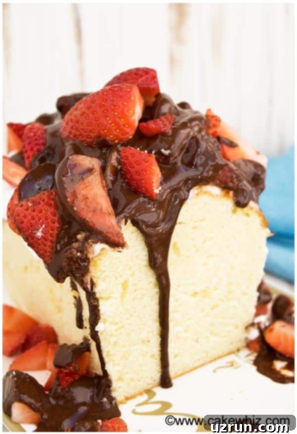 Classic Sour Cream Pound Cake Loaf 4 Homemade Southern-style sour cream pound cake loaf, generously adorned with luscious chocolate drizzle and vibrant fresh strawberry slices for a festive and delicious presentation.