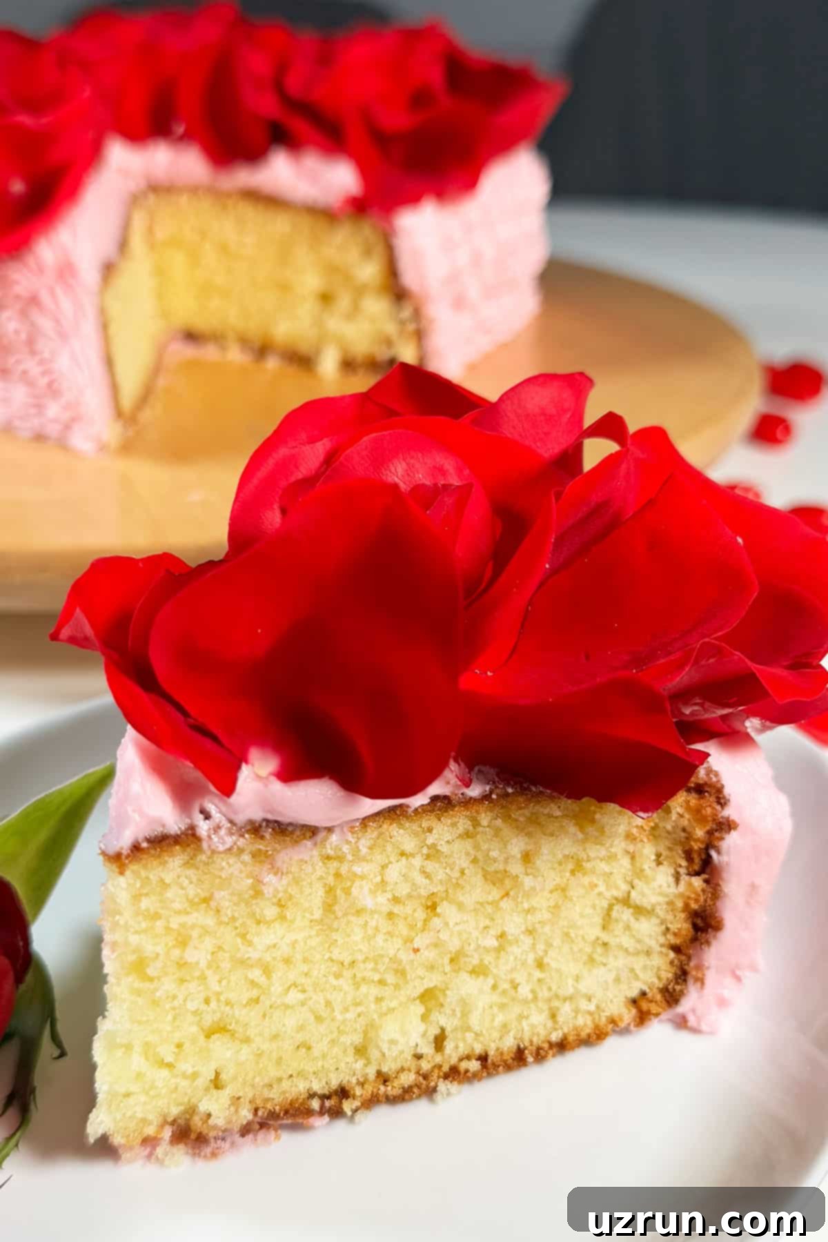 Fragrant Red Rose Cake with Rose Water 6 Slice of Cake on White Dish. A delectable slice of red rose cake on a white dish, showcasing its moist texture and delicate frosting.