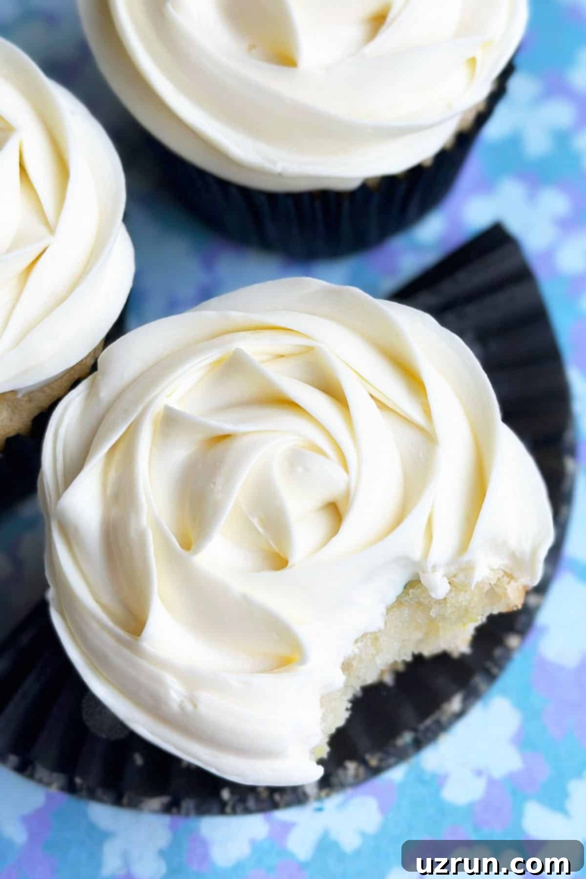 Moist Almond Sour Cream Cupcakes 4 Closeup Shot of White Icing on Top of Cupcake.
