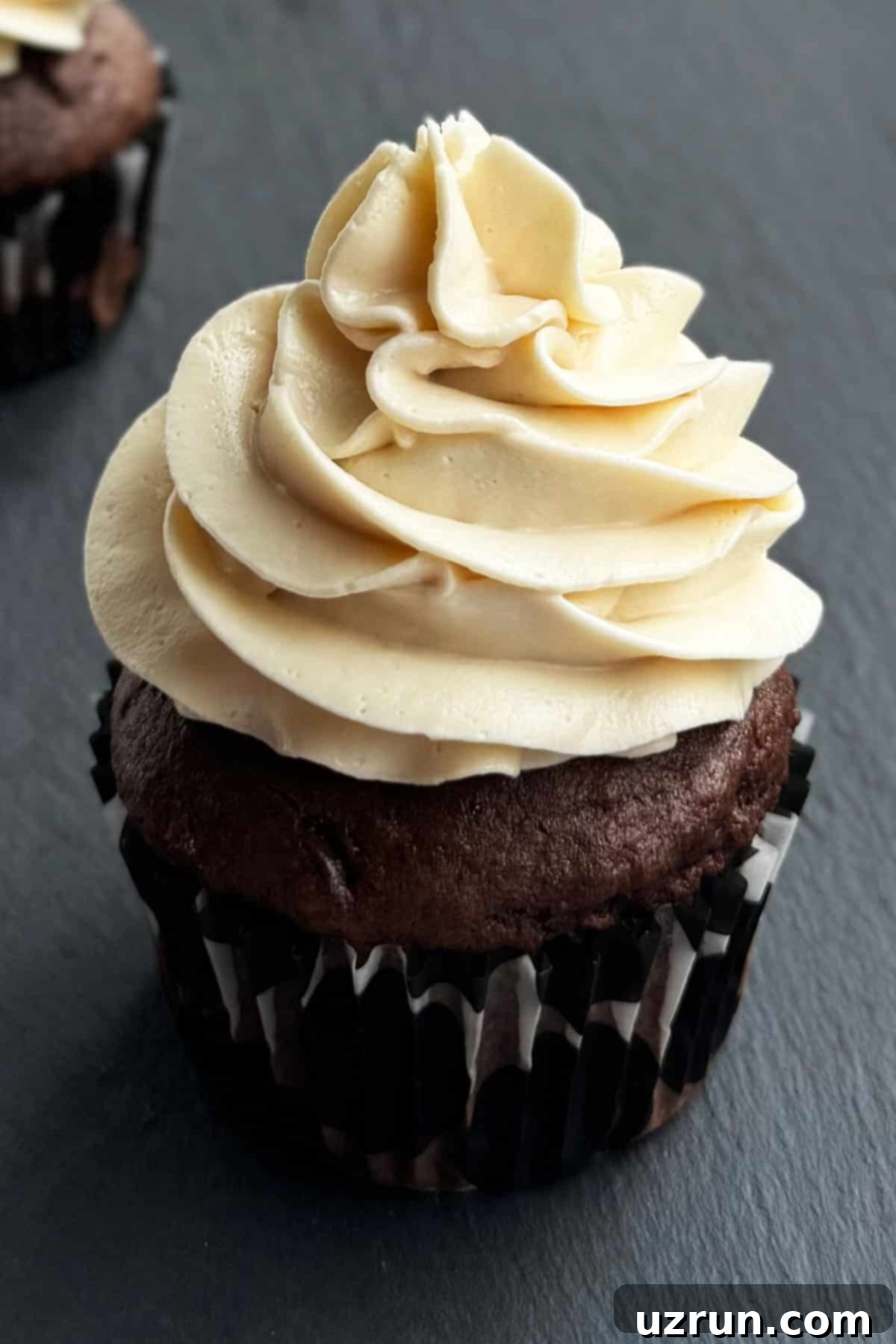Honey Frosting: Simply Sweet, No Powdered Sugar 5 Whipped Frosting Without Powdered Sugar Piped on Top of Chocolate Cupcake.