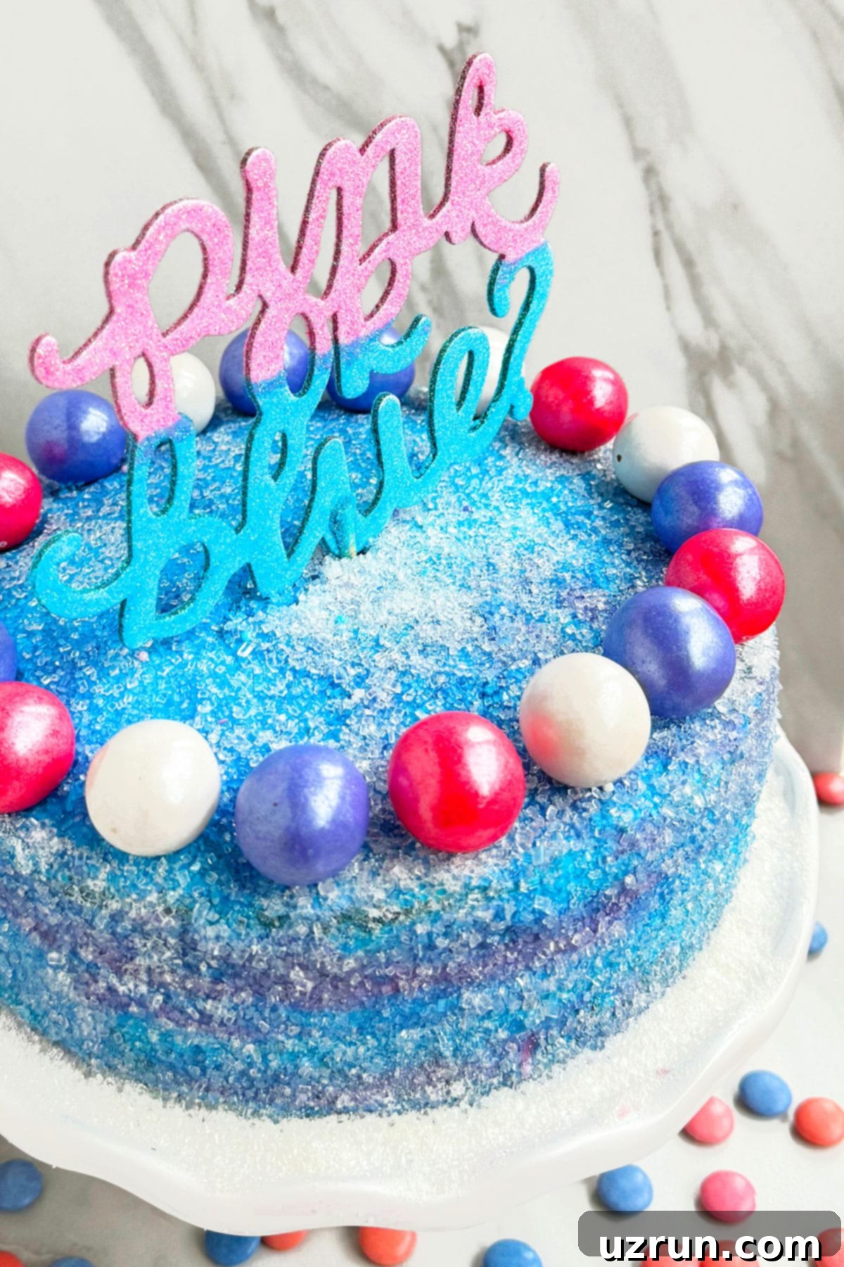 Stress-Free Baby Shower Gender Reveal Cake 7 Closeup Shot of Cake Topper With White Marble Background.