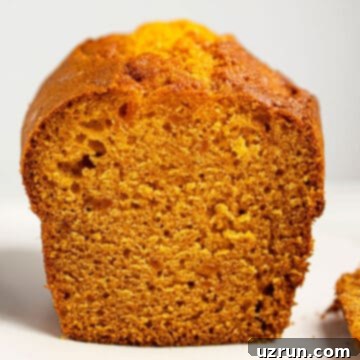 Easy Pumpkin Banana Bread Loaf With Cake Mix on White Dish.