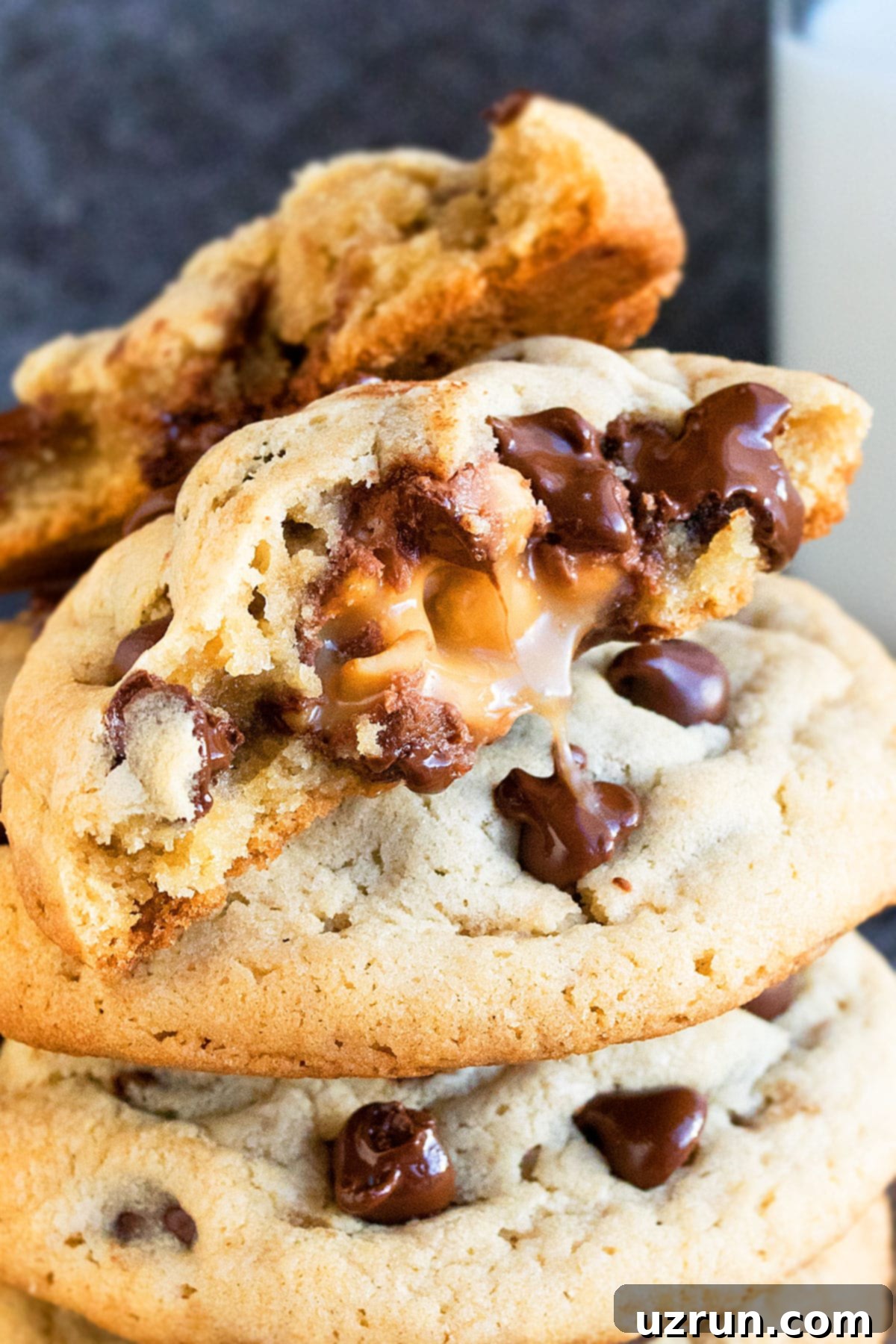 Salted Caramel Chocolate Chip Cookies 13 Closeup Shot of Cookie With Filling Leaking Out.