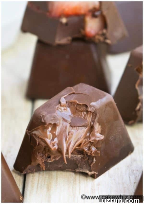Easy Homemade Gourmet Chocolate With Nutella Filling on Wood Background