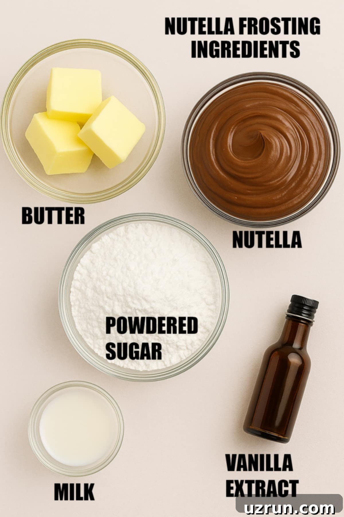 Creamy Nutella Hazelnut Buttercream 3 Ingredients for Nutella Frosting laid out on a marble surface, including Nutella jar, butter sticks, powdered sugar, and milk.