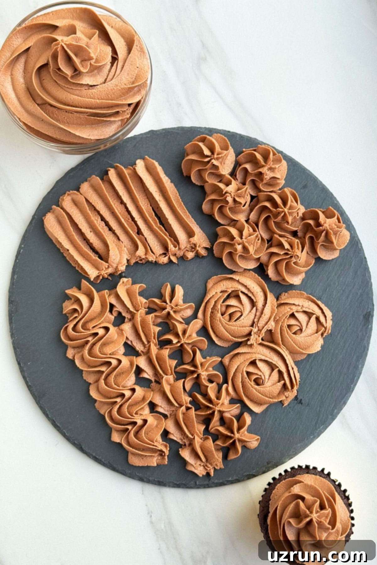 Creamy Nutella Hazelnut Buttercream 4 Nutella Buttercream Icing Piped on Black Dish.