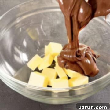 Creamy Nutella Hazelnut Buttercream 5 Nutella and butter in glass bowl ready to be mixed.