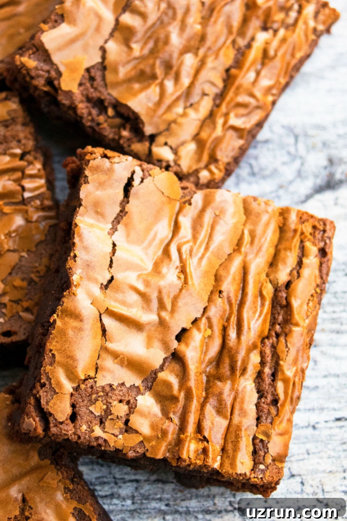 Easy Nutella Brownies with Just 3 Ingredients 3 Closeup Shot of 3 Ingredient Brownies on Rustic Gray Background.