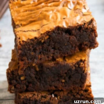 Easy Nutella Brownies with Just 3 Ingredients 7 Stack of Easy Nutella Brownies on Rustic Gray Background.