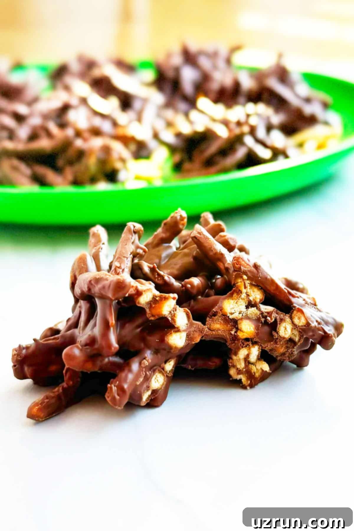 Easy No-Bake Chocolate Haystacks 3 Partially Eaten Cookie on White Background.