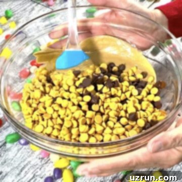 Easy No-Bake Chocolate Haystacks 4 Chocolate chips, butterscotch chips and peanut butter in glass bowl.