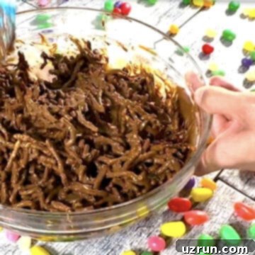 Easy No-Bake Chocolate Haystacks 8 Coated chow mein noodles in glass bowl.