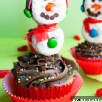 Snowman Cupcakes with Donut Heads 6 Easy Snowman Cupcakes With Donut Toppers on Green Background