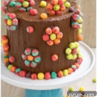 Easy Trix Cereal Cake 5 Easy Homemade Cereal Cake on White Cake Stand With Wood Background