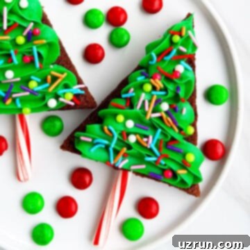 Christmas Tree Brownie Bites 12 Easy Christmas Tree Brownies With Buttercream Frosting on White Dish.