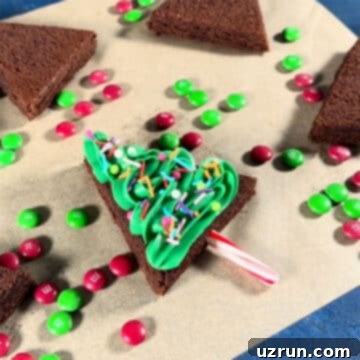 Christmas Tree Brownie Bites 9 Sprinkles tossed on top of frosted brownie.