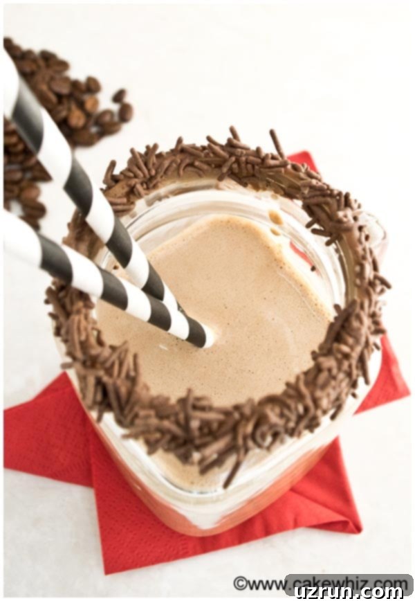 Mocha Smoothie 4 Overhead Shot of Chocolate Coffee Banana Breakfast Smoothie in Glass Cup with Striped Straws