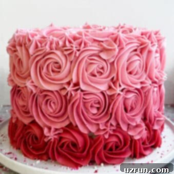 Pink Ombre Mother's Day Celebration 10 Easy Mother's Day Cake (Pink Ombre Cake) on White Dish.