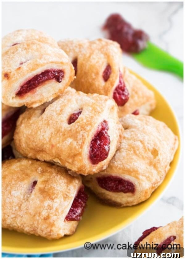 Easy Strawberry Strudel with Puff Pastry 5 Mini Strudels With Preserves on Yellow Dish