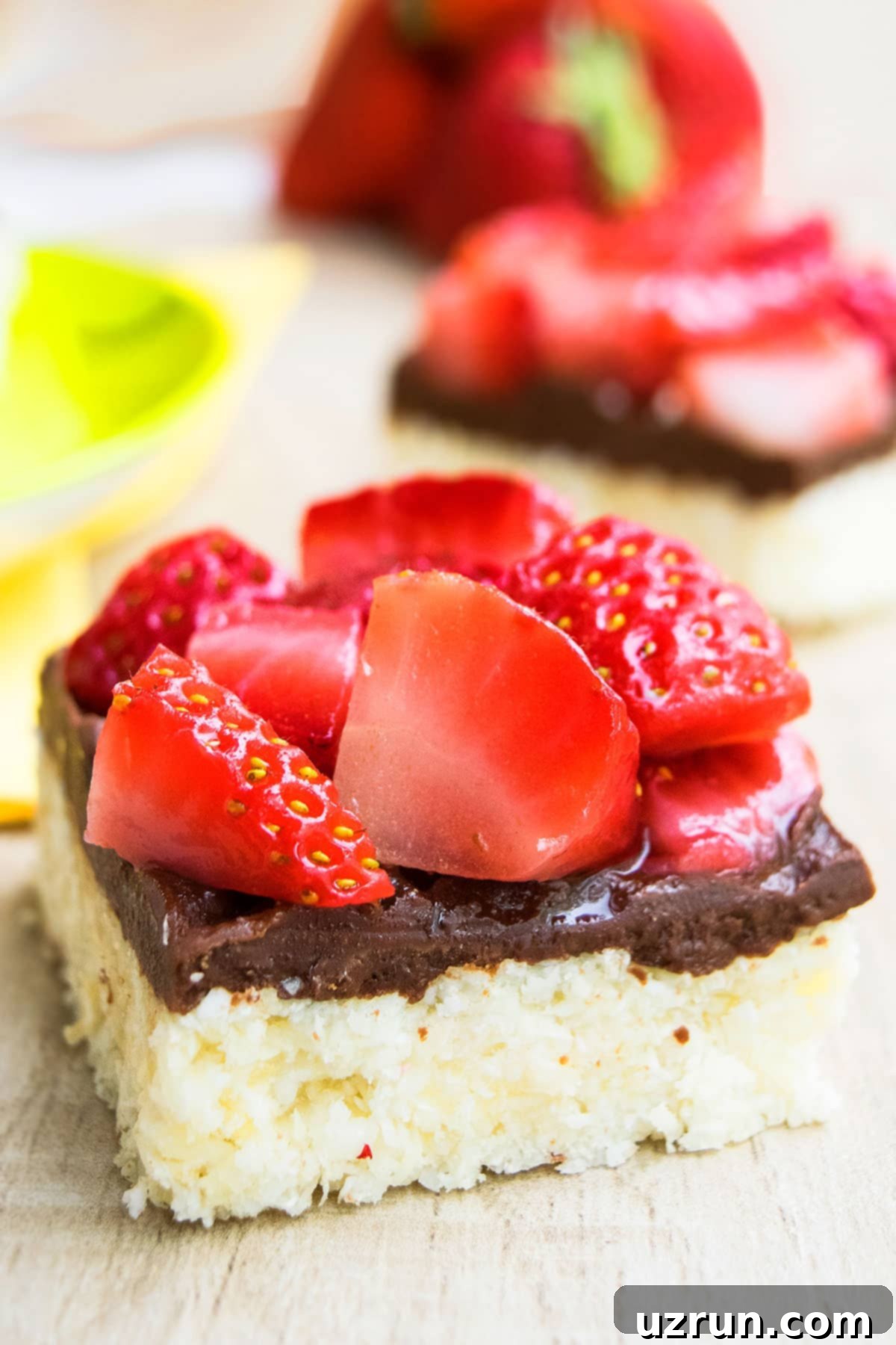 Chocolate Coconut Macaroon Bars 10 Slice of No Bake Bars on Wood Table, showcasing the beautiful layers and texture.