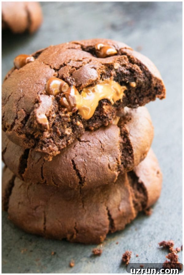 Stack of Three Triple Chocolate Cookies on Gray Background