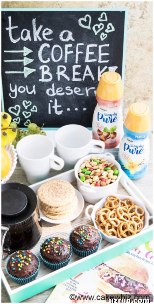 A beautifully arranged home coffee bar with various snacks, coffee, and decor.
