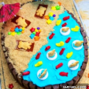 Backyard Fun Kids' Summer Cake 10 Easy Summer Cake (Beach Cake) With Kit Kat on Marble Background.