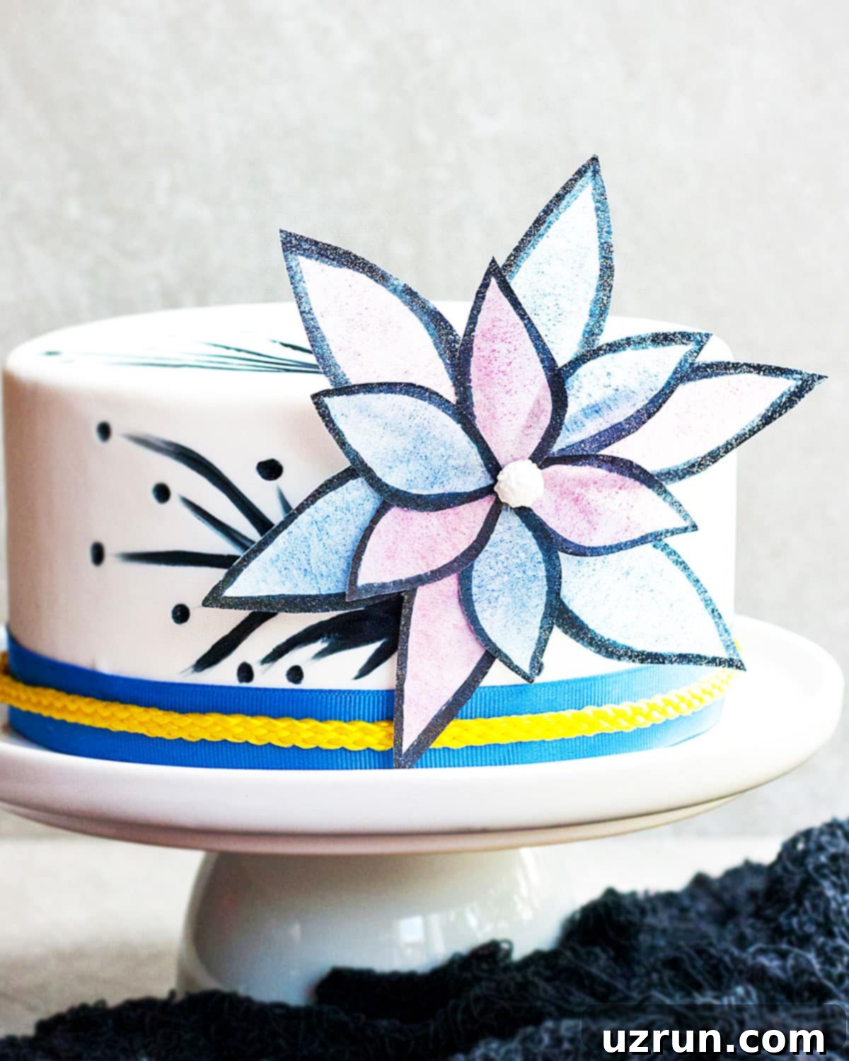 Easy Cake Decorating Ideas for Beginners 19 A cake adorned with delicate wafer paper flowers and leaves, creating an elegant, airy design.