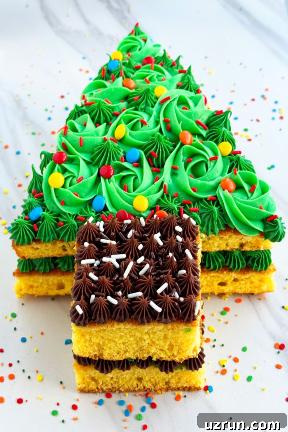 Easy Christmas Tree Cake 8 Decorated Cake on White Marble Background.