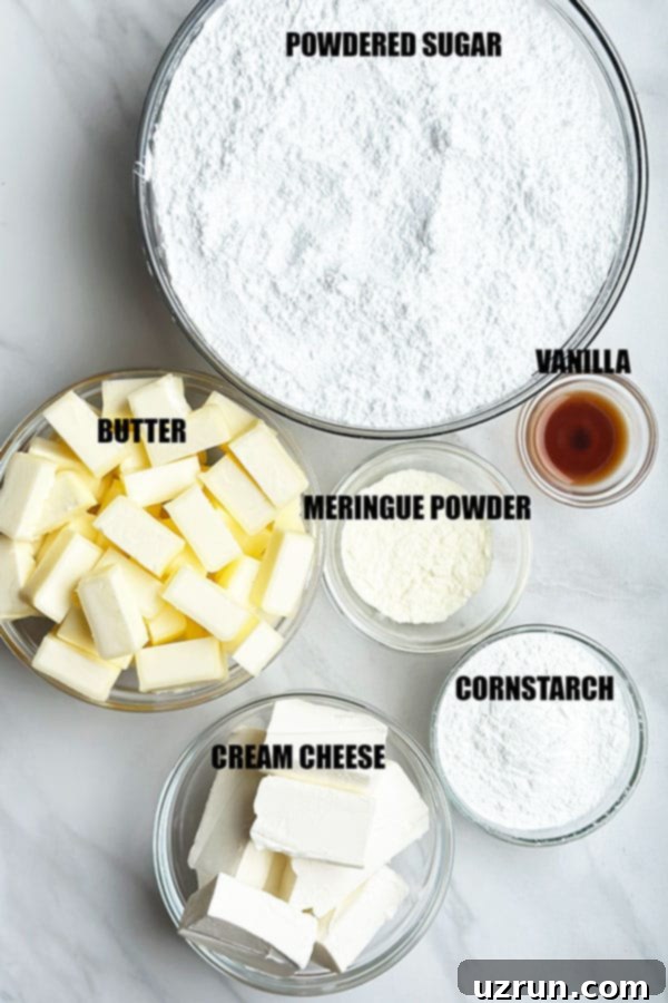 The Best Stable Cream Cheese Frosting 3 Cream Cheese Frosting Ingredients in Glass Bowls on Marble Background