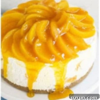 Chilled Peach Cheesecake Dream 6 Best Easy No Bake Peach Cheesecake on White Cake Stand, garnished with fresh peaches.