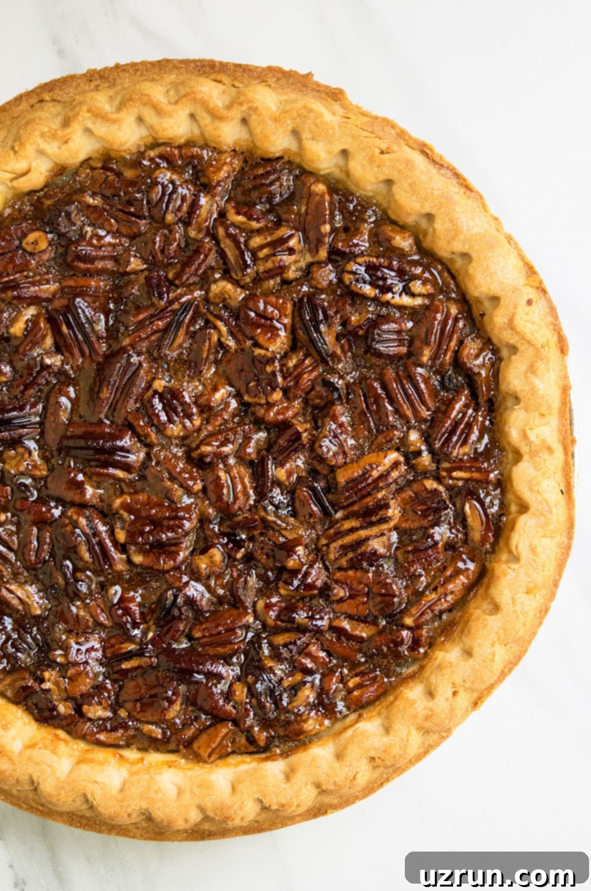 Classic Homemade Pecan Pie on White Background- Overhead Shot